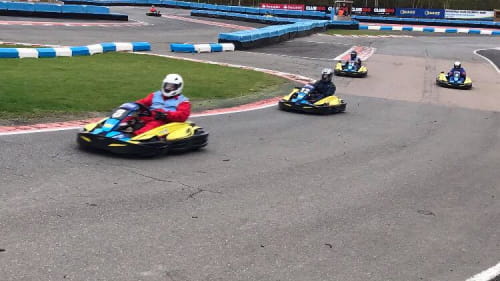 Karts racing around a track